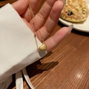 dây chuyền titan vàng trái tim